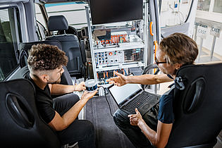 two persons sitting in a car for ADAS