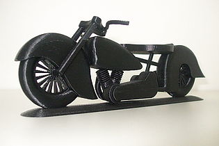 A modelled motorcycle with three wheels