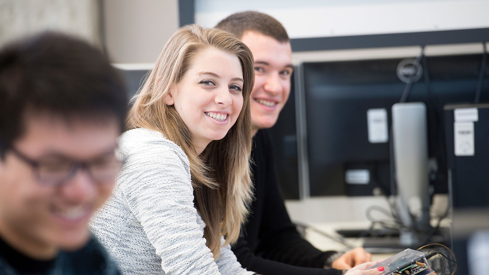 Students of Computer Engineering tinker with some hardware.