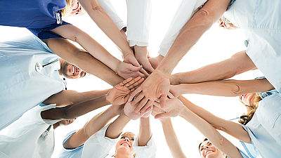 Multiethnic Medical Team Stacking Hands