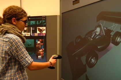 Student analyzes and evaluates her design and styling data from CAD and CAS systems, at the powerwall. Photo: Esslingen University/ Faculty of Automotive Engineering