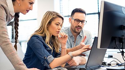 Group of business people and software developers working